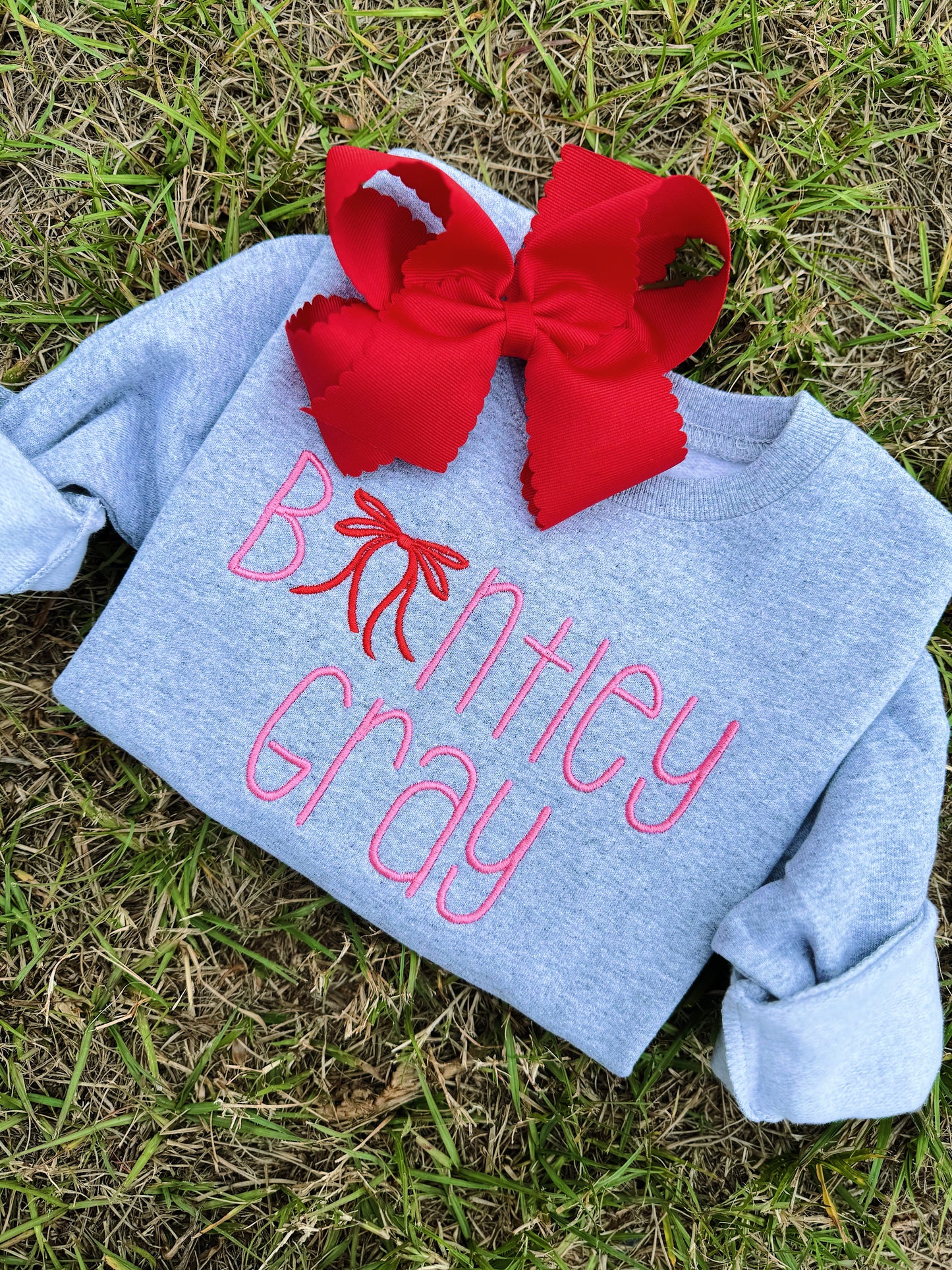 PINK + RED BOW CREWNECK - ETA: 4 weeks